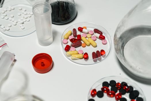 various prescription medication bottles and physical therapy equipment arranged on a table