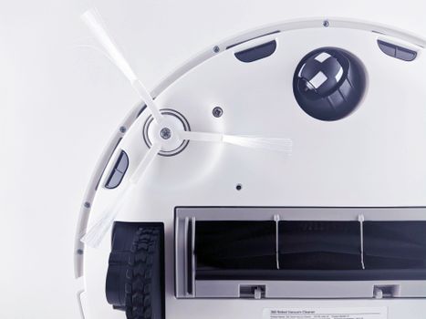 A consumer comparing robot vacuum price tags and specifications on a digital tablet screen