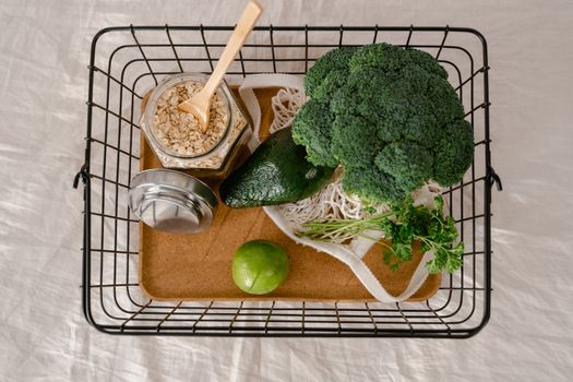 raw ingredients for budget meal prep including beans rice and chicken on wooden table