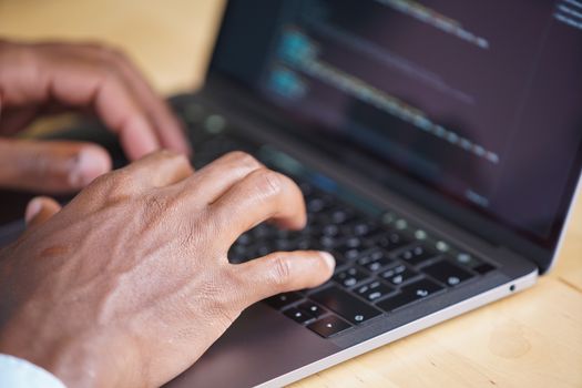 A close-up shot of a person using a laptop to compare different insurance policy quotes on a screen.