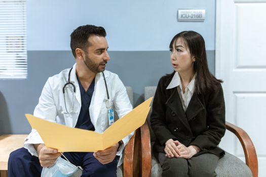 A doctor consulting with a patient in a modern clinical office setting