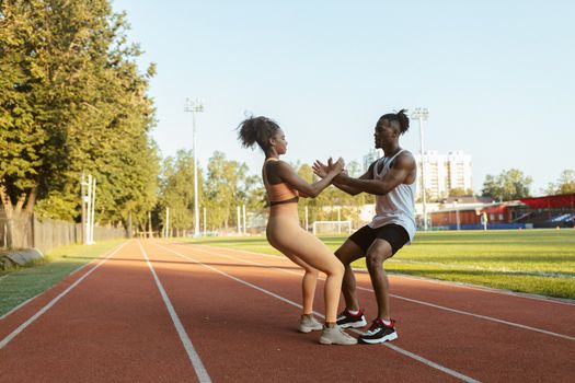 fitness enthusiast performing dynamic leg swing warm up outdoors