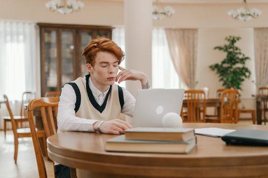 A person looking at a document showing an approval status on a computer screen