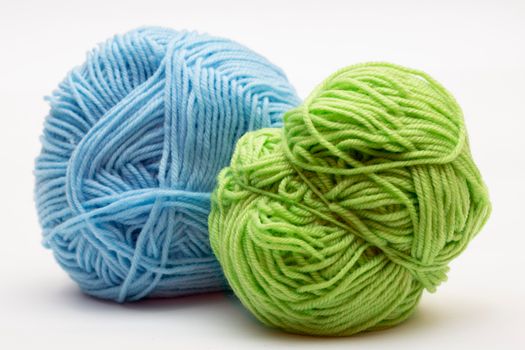 categorized yarn weights arranged sequentially from lace weight to super bulky weight on a white table